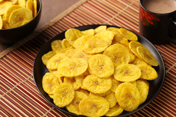 banana chips, popular Kerala snack deep fried in  coconut oil. traditional South Indian tea time snack on banana leaf, Kerala India on Onam, Vishu, Diwali, Ramzan