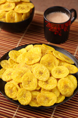 banana chips, popular Kerala snack deep fried in  coconut oil. traditional South Indian tea time snack on banana leaf, Kerala India on Onam, Vishu, Diwali, Ramzan
