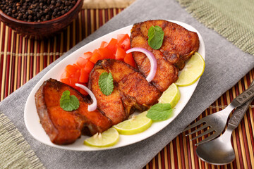 Fried fish, Kerala Fish fry in coconut oil India. Top view of fresh seafood curry served in house boat of Alappuzha. King or Barracuda fry. non vegetarian Indian food.	