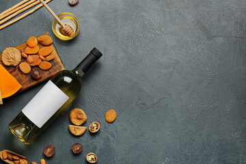 Composition with bottle of wine on dark background