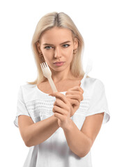 Naklejka premium Beautiful young woman with different forks on white background