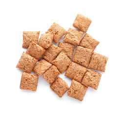 Tasty corn pillows on white background