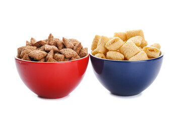 Bowls with tasty corn pillows on white background