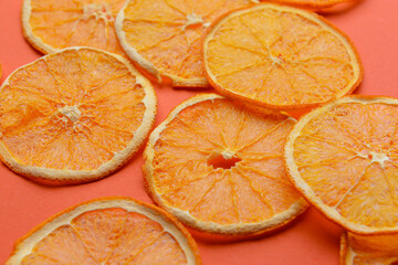 Dried orange slices on color background
