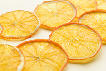 Dried orange slices on light background, closeup