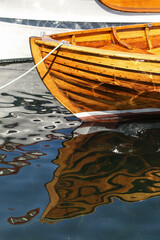 wooden boat, reflection in water
