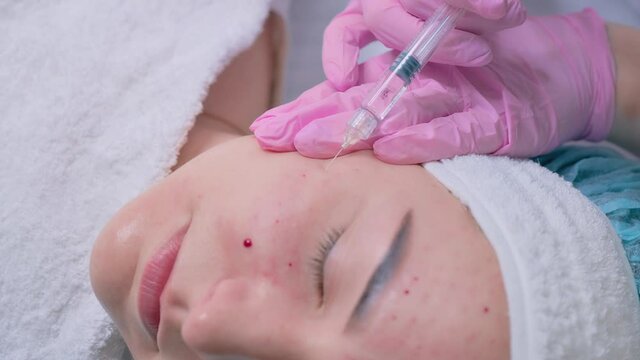 Woman on the procedure of mesotherapy injection