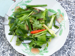 Pomfret Fish dish cooking with various ingredients. Fresh raw fish decorated with vegaetable. Steaming Fish Chinese Style.
