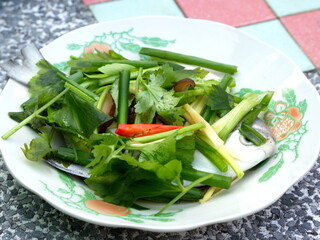 Pomfret Fish dish cooking with various ingredients. Fresh raw fish decorated with vegaetable. Steaming Fish Chinese Style.