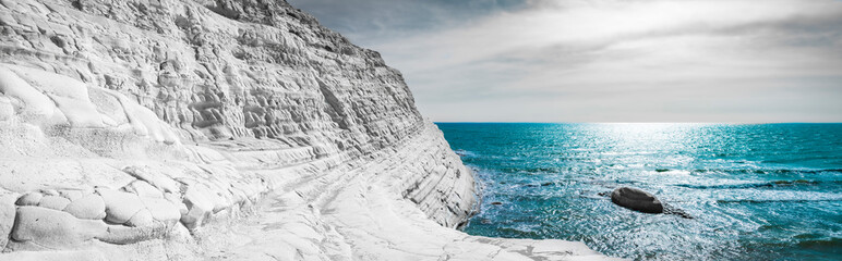 Panoramic view of a massive white rock by the sea. Concept sea and sky, copy space.  Scala dei Turchi in Agrigento, Sicily