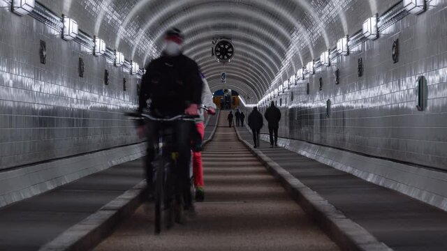 Day Timel apse of a old elb tunnel with pedestrian, Hamburg, Germany