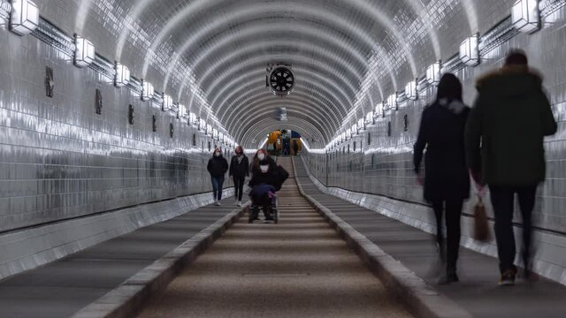 Day Timel apse of a old elb tunnel with pedestrian, Hamburg, Germany