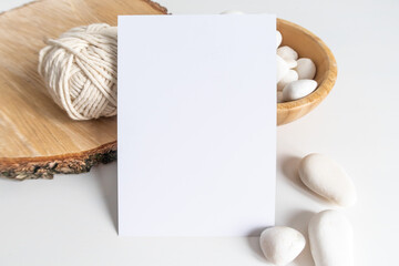 Boho vertical postcard mockup with white yarn on a white table background. Rustic bohemian image....