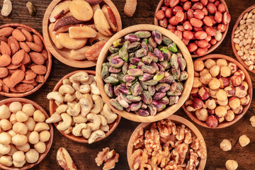 Nuts variety, overhead flat lay shot of many bowls