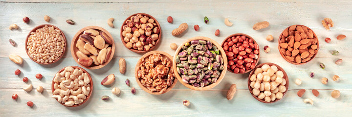 Nuts panorama. Pistachios, almonds, cashews, and many other nuts