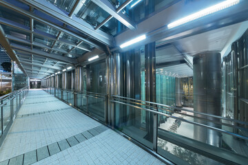 Modern pedestrian walkway in downtown district of Hong Kong city