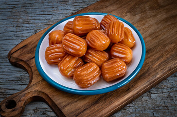 Tulumba tatlısı or bamiyeh dessert and taş kadayıf or atayef on the table at ramadan dinner