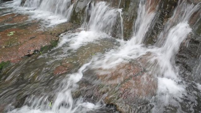 Running water through rocks. at Namtok Samlan National Park.Selective focus.