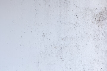 Light blue wall with abstract spots. Beautiful gray, white texture, abstract wall surface background, vintage surface texture with copy space, unusual mottled surface