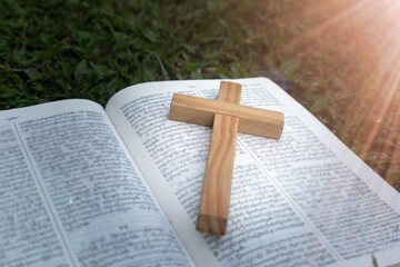 The cross is placed on the open Bible. A prayer asks for the blessing of Jesus. God believes in the divine power of God through prayer to Him Christianity Jesus.