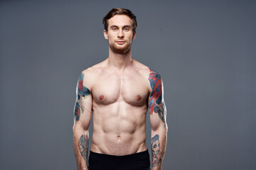 male topless muscled abs tattoo cropped workout view