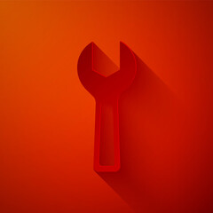 Paper cut Wrench spanner icon isolated on red background. Paper art style. Vector