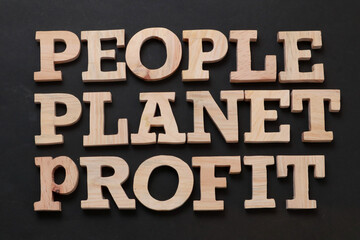 People Planet Profit, text words typography written with wooden letter on black background, life...
