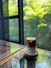 a glass of coffee with mil. Cafe concept