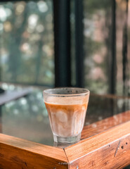 a glass of coffee with mil. Cafe concept