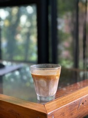 a glass of coffee with mil. Cafe concept
