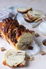 Babka or brioche bread with cinnamon and brown sugar. Homemade pastry for breakfast.