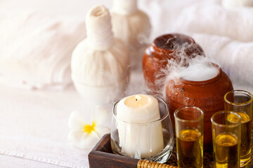 Obraz na płótnie Canvas spa theme with candles on wooden background. Massage therapy for one person with candle light. Beauty spa treatment and relax concept.