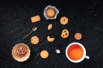 Danish butter cookies with a cup of tea, overhead flat lay shot