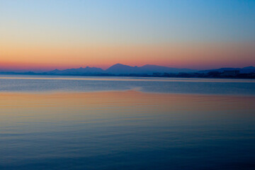 A calm Mediterranean Sea after sunset, Side, Turkey.