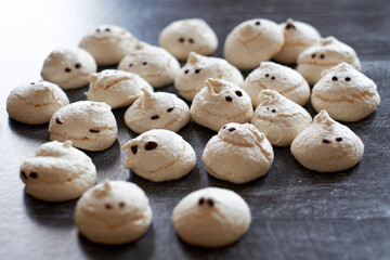Funny and delicious meringue ghoast as halloween party decor. 