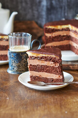 Chocolate cake on a wooden table. Side view