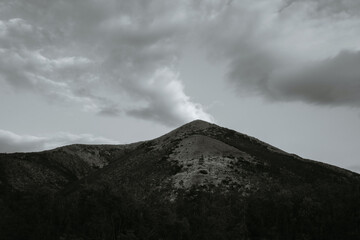 landscape with a hill top and clouds