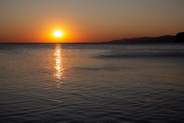 Obraz premium Sunset at sea in clear weather