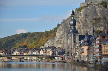 Dinant is a city in Belgium’s Walloon Region. It’s on the banks of the Meuse River and backed by steep cliffs. 
