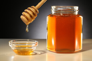 jar of honey with dipper
