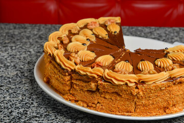 Chocolate honey cake, selective focus. Delicious sweet cake for tea or coffee time.