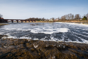 Venta Rapid waterfall, the widest waterfall in Europe and long brick bridge, Kuldiga, Latvia.