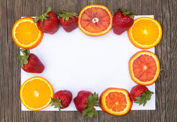 Frame of strawberry and oranges