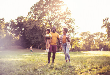  African American family having fun in the park.