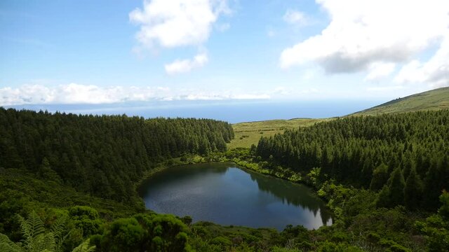 Timelapse clouds in the green mountains and lagoon in the Azores