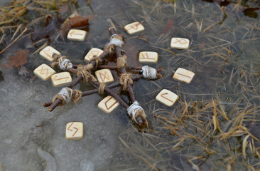 Runes and pentagram in the water outside, magic ritual.  Esoteric, gothic and occult background, Halloween mystic and wicca concept outdoors.