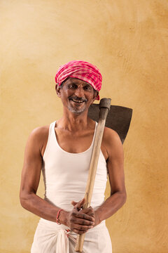 Portrait of a Farmer holding a Shovel	