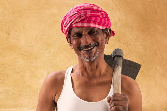 Portrait of a Farmer holding a Shovel	