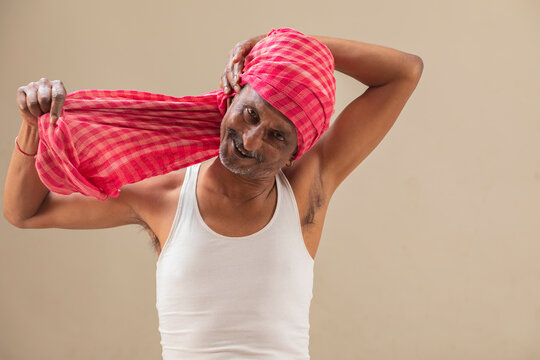 Farmer tying his turban	