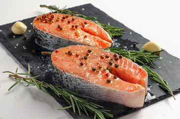 Fresh salmon steak on a stone plate